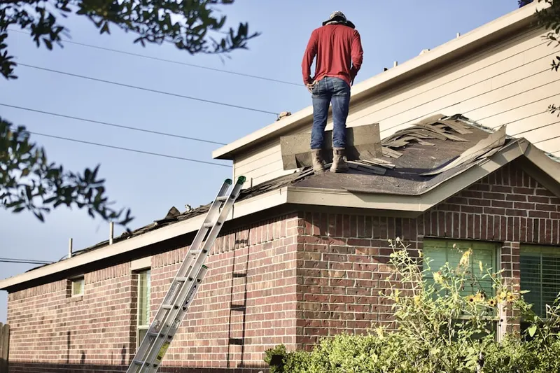 Professional roofer working on a residential roof in Perryman
